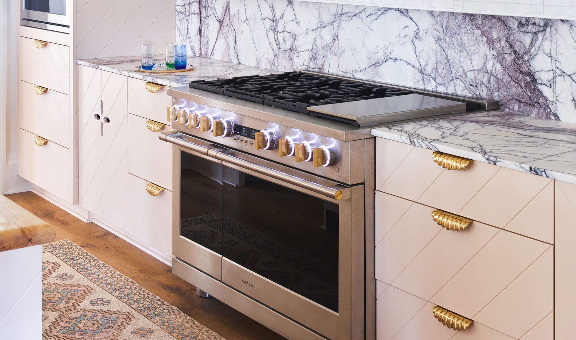 Monogram 5-in-1 Oven installed in pink cabinets